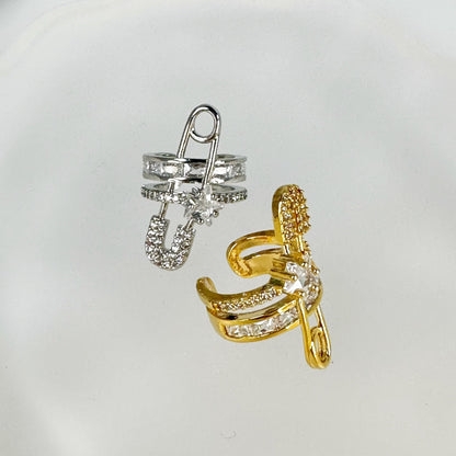 Gold plated ear cuff in a unique paper clip design, embellished with sparkling cubic zirconia, isolated on a white background