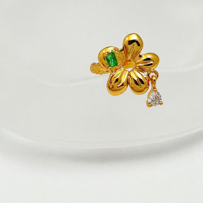 Elegant ear cuff with 18k gold plating, showcasing a bright green gemstone and delicate gemstone drop detail.