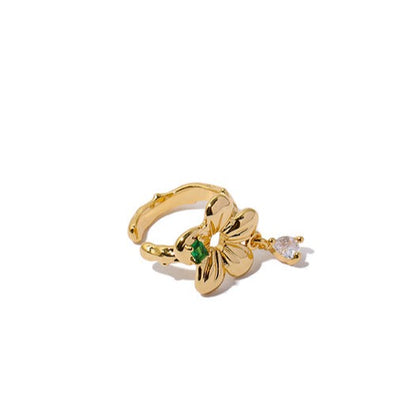 Elegant ear cuff with 18k gold plating, showcasing a bright green gemstone and delicate gemstone drop detail.