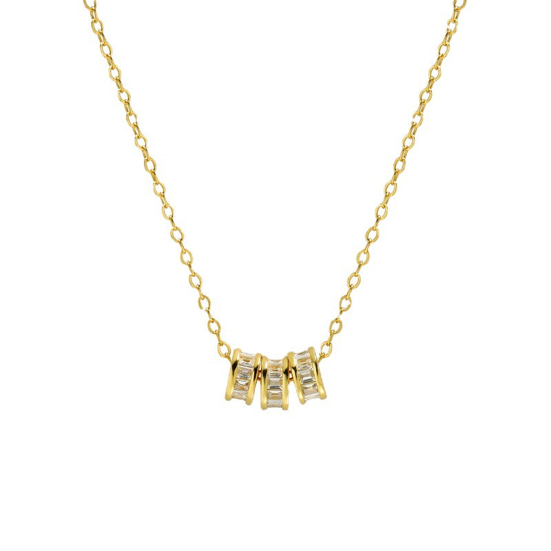 Elegant Lucky Trio Necklace in gold vermeil, featuring three cubic zirconia encrusted charms on a delicate chain, showcasing a sparkling, sophisticated design