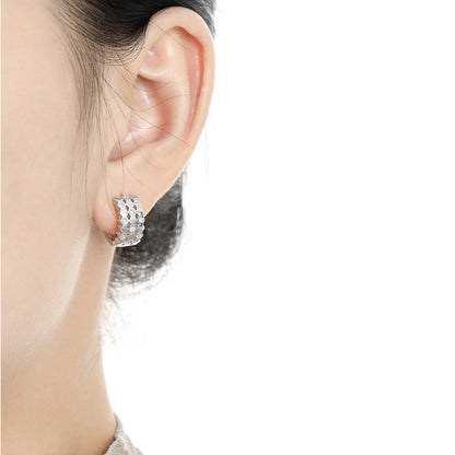 Pair of SOHO Earrings crafted from S925 silver, featuring a geometric pattern with sparkling accents