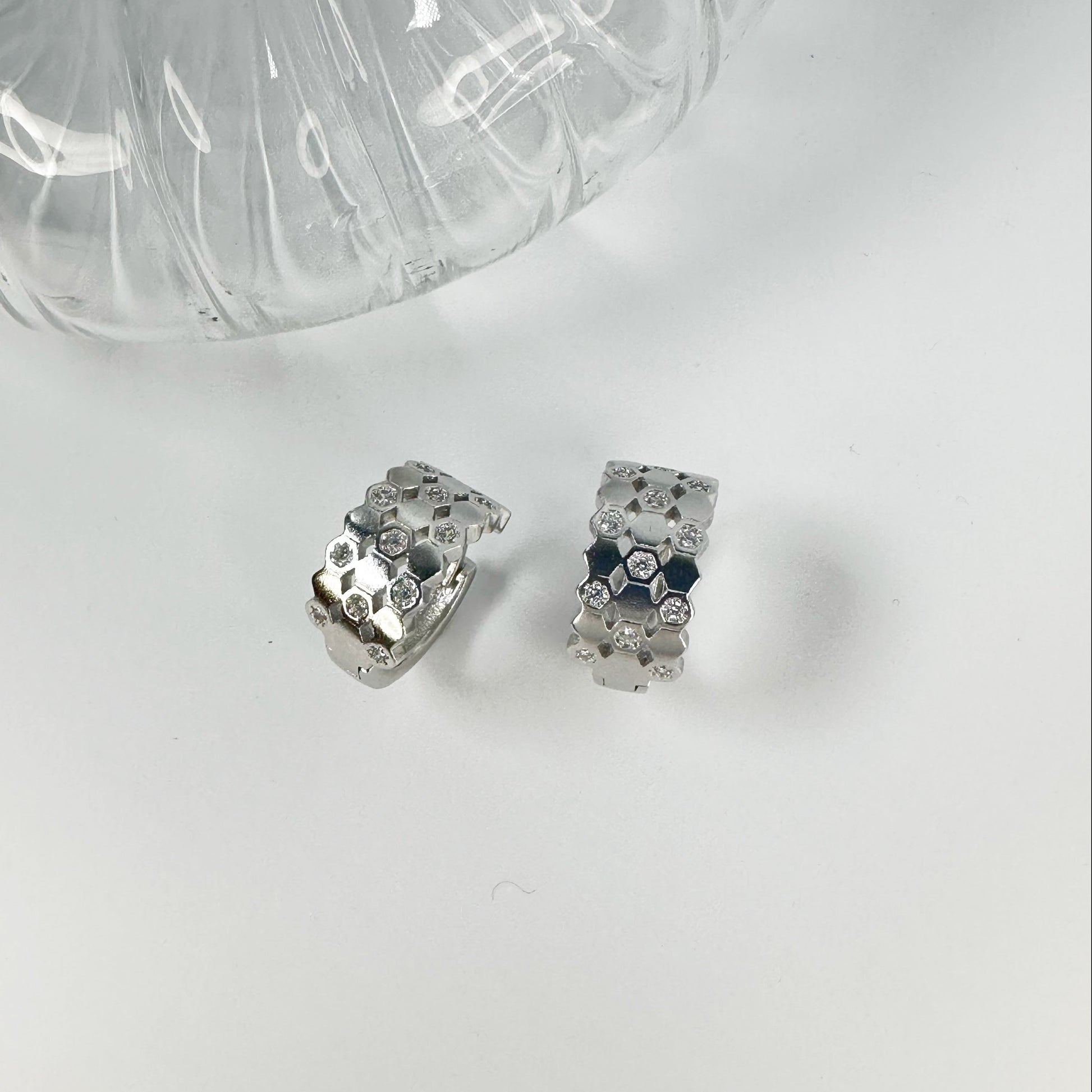 Pair of SOHO Earrings crafted from S925 silver, featuring a geometric pattern with sparkling accents