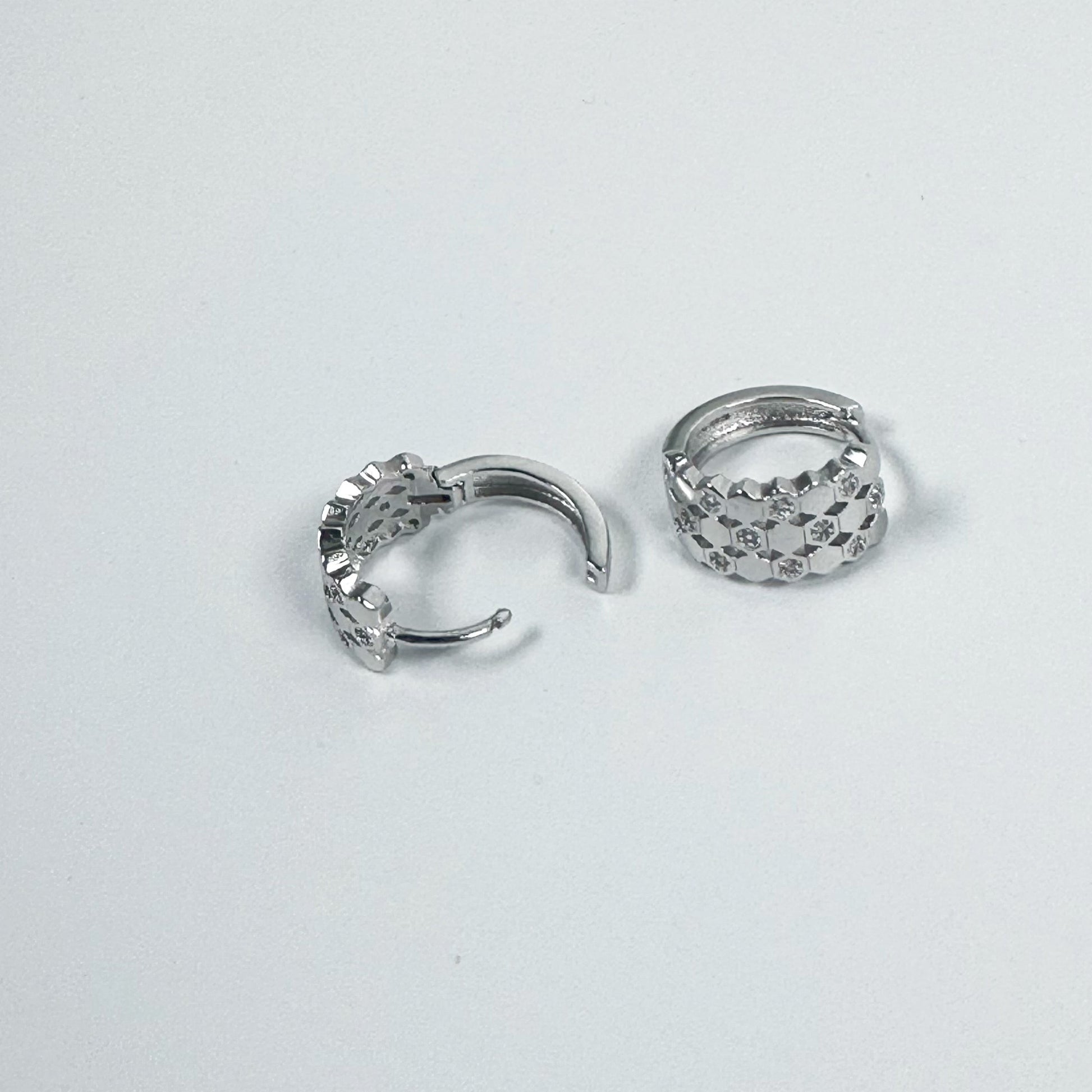 Pair of SOHO Earrings crafted from S925 silver, featuring a geometric pattern with sparkling accents