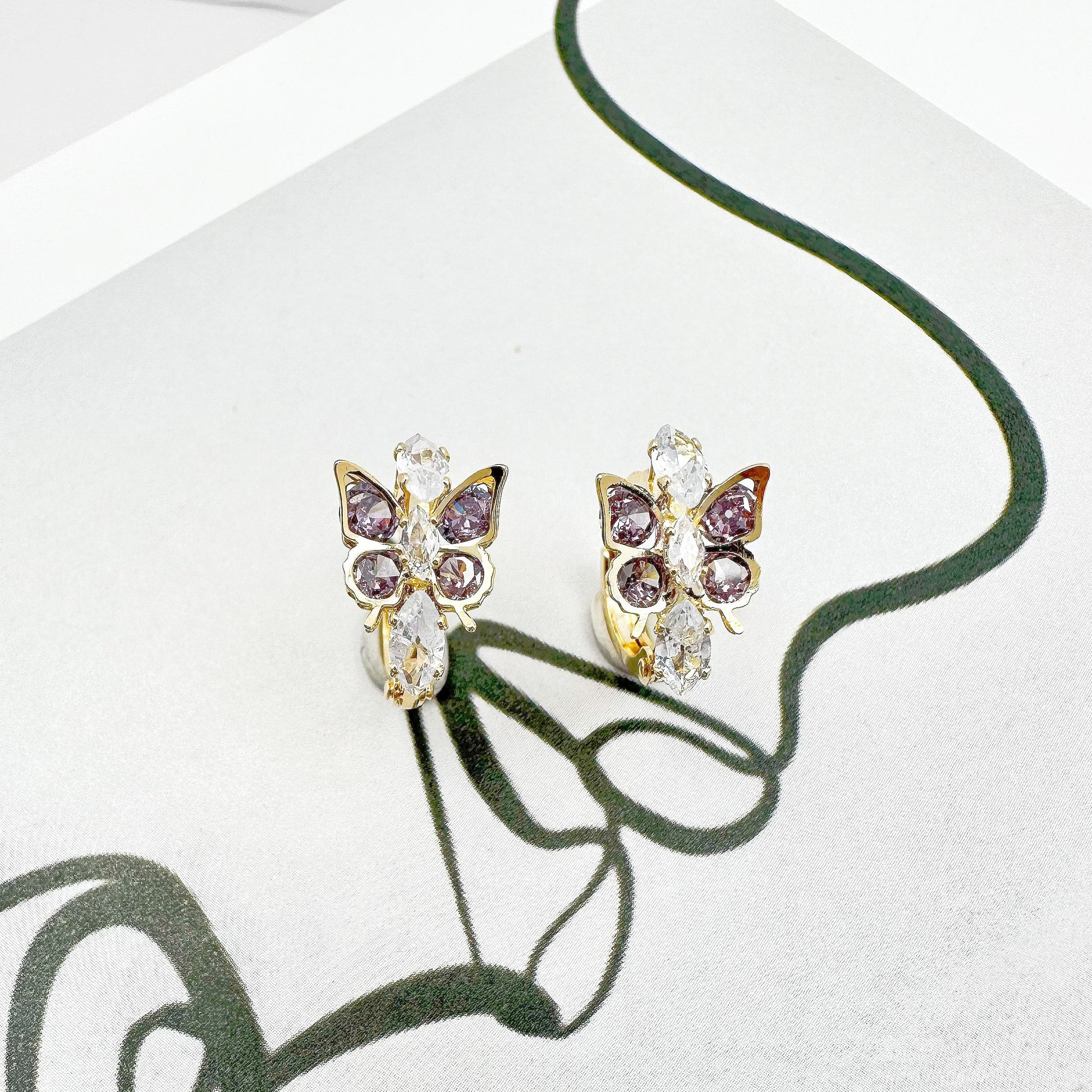 Elegant Dancing Butterfly Earrings with multi-colored zircon stones and 18k gold plating, offering a vibrant touch to both casual and formal attire.