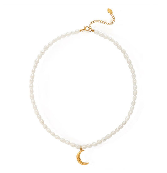 Time-honored freshwater pearl necklace with a unique 18k gold plated crescent moon charm.