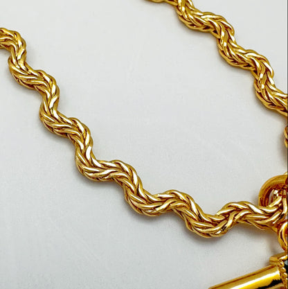 Elegant necklace with a gold-plated twisted chain and a rectangular green zircon pendant.