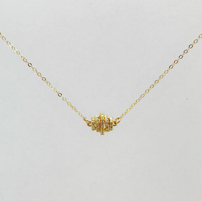 Gold-filled chain necklace with a zircon-studded pendant in a classic design