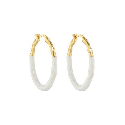 Gold Vermeil hoop earrings with a pastel blue dripping glaze finish.