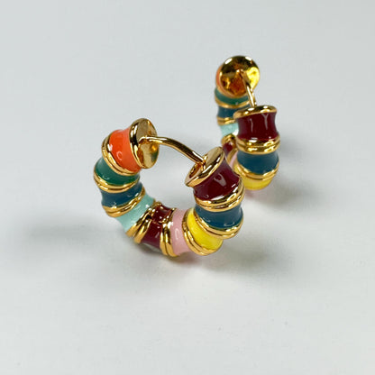 Rainbow Hoop Earrings in 18k gold plating featuring a vibrant array of enamel colors presented on a clear background.