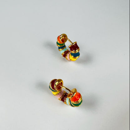 Rainbow Hoop Earrings in 18k gold plating featuring a vibrant array of enamel colors presented on a clear background.